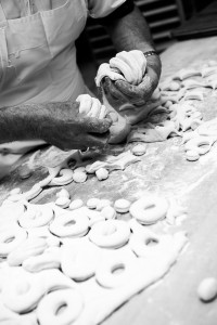 black and white photo of baker working with dough