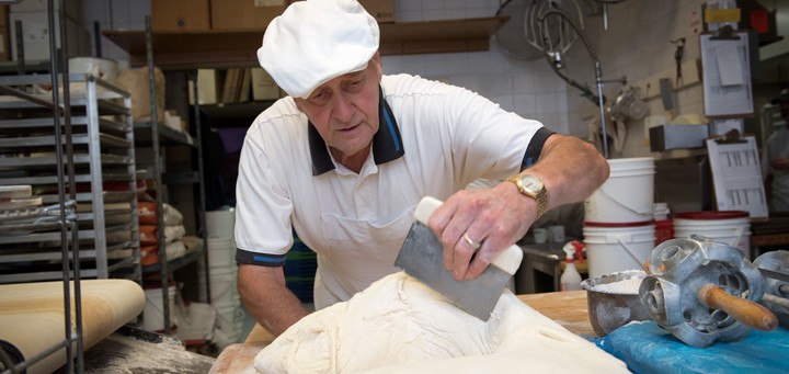 Baker working with dough
