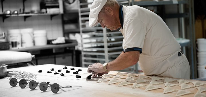 Baker making pastries