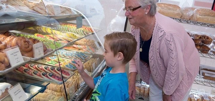 grandma and boy at baking display