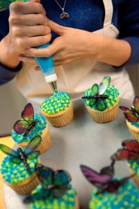 cupcakes being iced