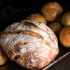 Large loafs of round, flour sifted bread