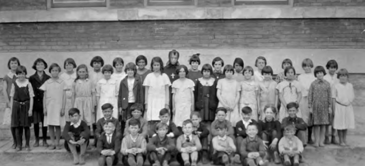 Black and white class photo of St. Albert Catholic School