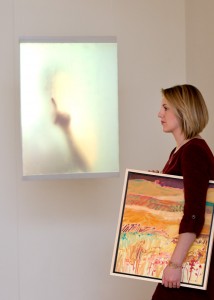 Woman carrying a painting