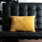 Black Chair with yellow pillow