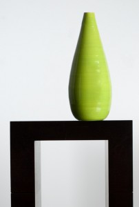 green vase on black table