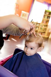 Little kid getting a hair cut