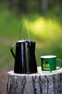 kettle and cup on a stump