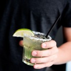 Margarita glass, with salt rim and lime