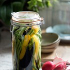 jar with dill, pickles, cucumber and beans