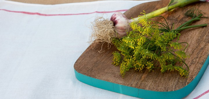 dill and chives on cutting board