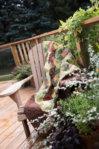 Colourful quilt on deck chair