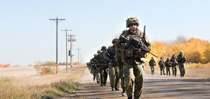 soldiers marching on road