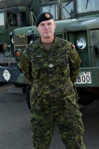 soldier standing in front of truck