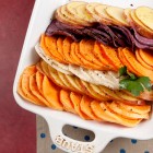 scalloped turnips and potatoes on a serving platter